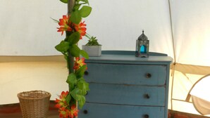 A blue dresser with a small potted plant and a lantern on top. - Cosy 5m Bell Tent Glamping in Rural Herefordshire (Hereford)