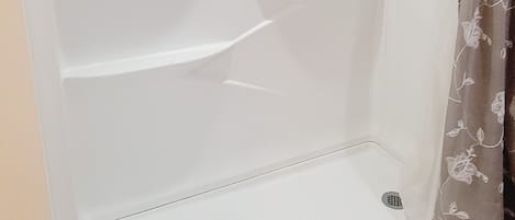 Combined shower/tub, hair dryer, towels, soap