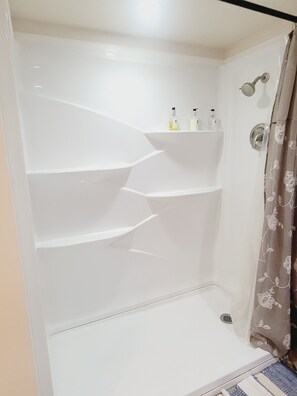Combined shower/tub, hair dryer, towels, soap