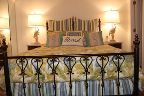 Restful retreat with a bed, nightstands, and a classic design.