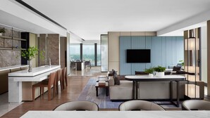 A modern interior with a kitchen, dining area, and seating space. - JW Marriott Shanghai Fengxian (Shanghai)