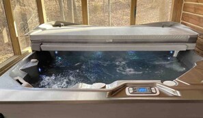 A hot tub with a digital control panel, priced at $189 per night. - Cardinal Cabin with Hot tub, WIFI, Dish, park pass (Birdseye)
