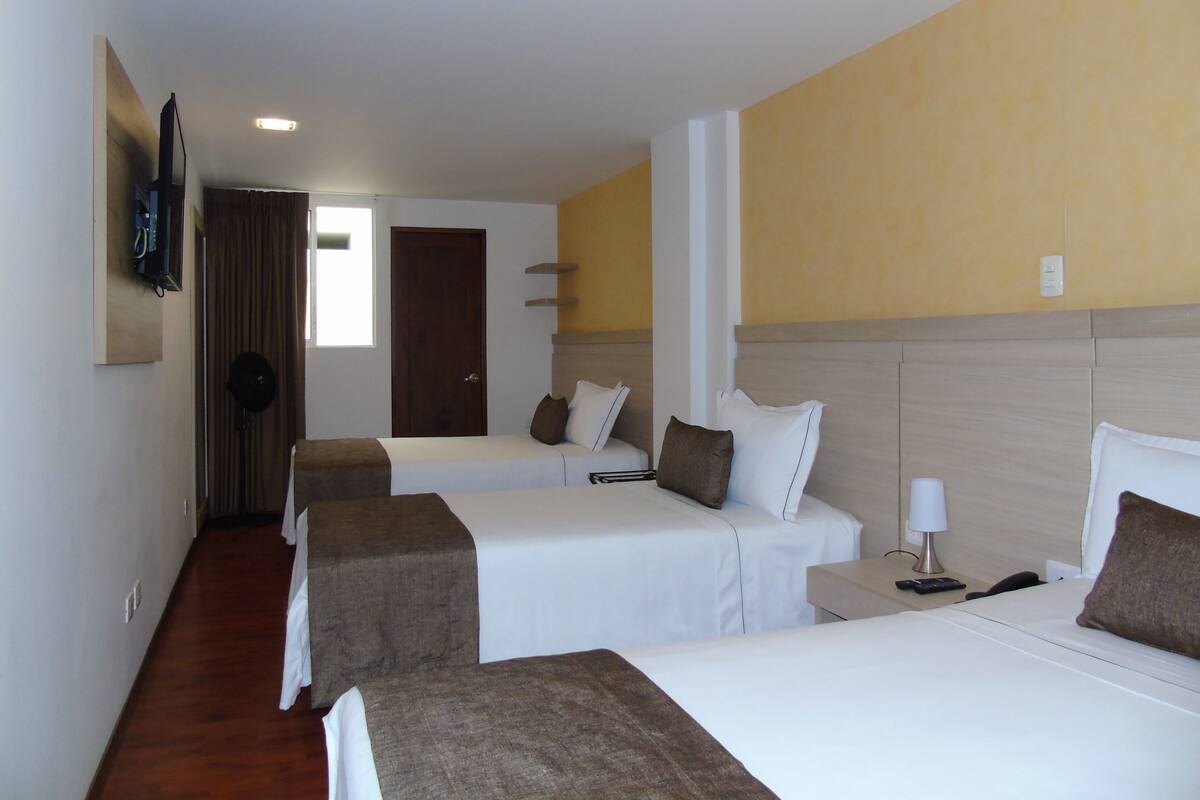 Standard Triple Room | Blackout drapes, iron/ironing board (on request), WiFi (free)