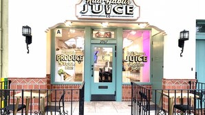 A storefront with a sign reading "Rad Habits JUICE" and windows displaying "Organic PRODUCE BOWLS BITES" and "Gold-Pressed JUICE SMOOTHIES SHOTS". - Boutique South Park Craftsman Studio (San Diego)