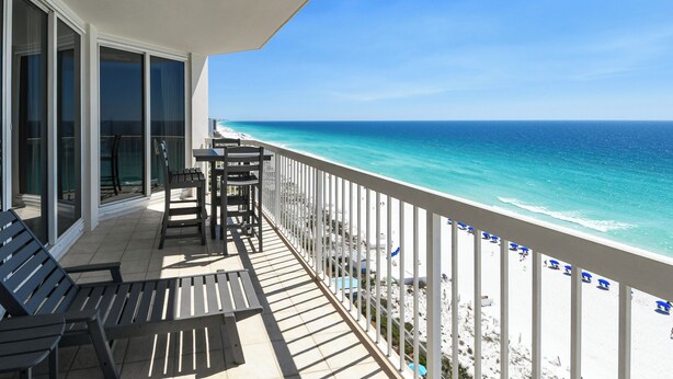A balcony with a view of the ocean, outdoor furniture, and a railing. - Coastal 12th Floor Beachfront Condo w/ Close Dining & Shopping in Destin! 🌊🌴💙 (Destin)