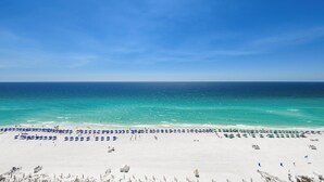A beach with white sand, a clear blue sky, and the ocean. - Coastal 12th Floor Beachfront Condo w/ Close Dining & Shopping in Destin! 🌊🌴💙 (Destin)