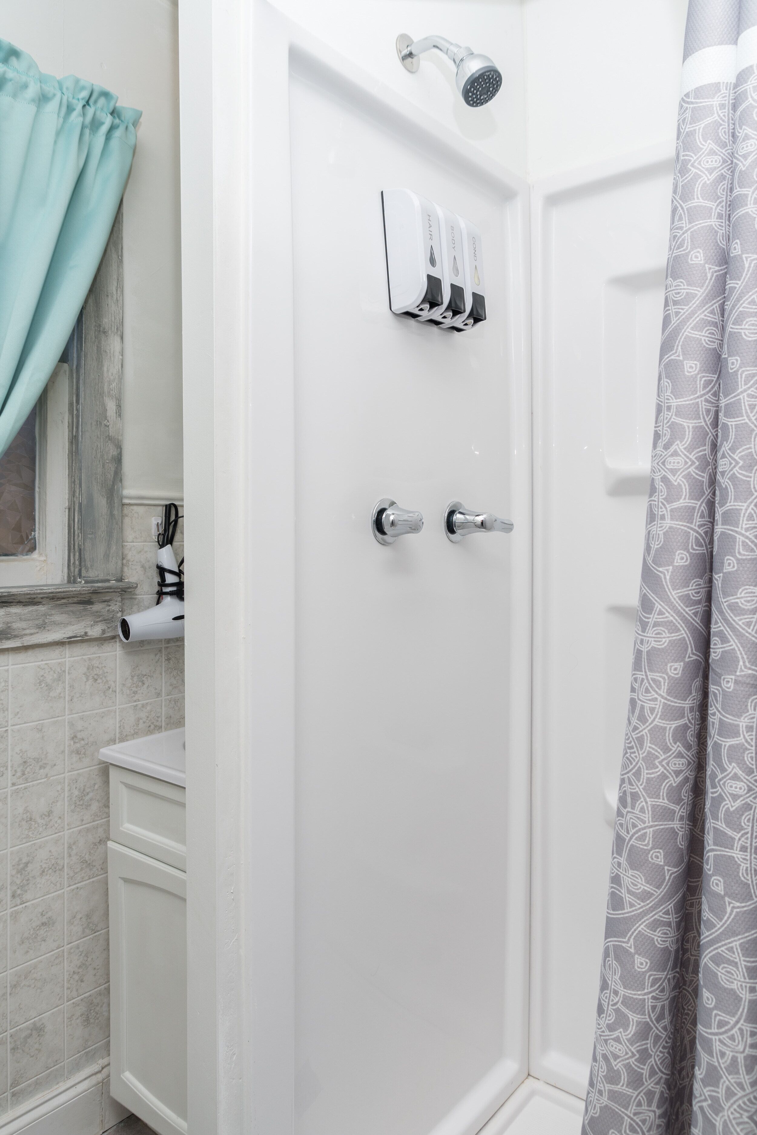 Shower, hair dryer, towels, soap