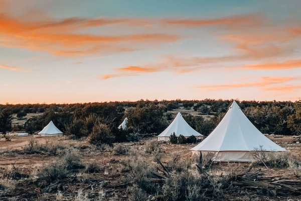 A look inside one of our King tents which includes 1 King bed. Note: furniture, décor and bed configuration may differ between tents.