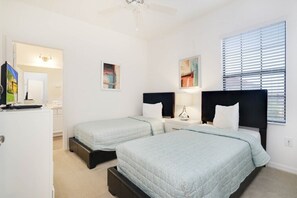 A bedroom with two beds, a desk, a chair, a ceiling fan, and artwork on the walls. - New Listing! Providence Resort, 9mi to Disney & 18mi to Universal - FS326676 (Davenport)