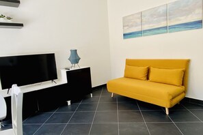 Living area - GuestHost - Cozy and bright apartment totally new, both in the renovation and in the contemporary style furnishings. The flat is located just 5 meters from the beach and has a balcony with sea view, as well as every kind of comfort to accommodate up to 3 (Salerno)