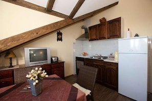 Apartment (One Bedroom Apartment with Sea View) | Private kitchen | Fridge, coffee/tea maker, toaster, dining tables