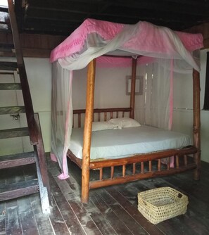 A wooden four-poster bed with a canopy, a woven basket on the floor, and a wooden ladder. - Room-mida Creek Eco Camp - Cottage House (Watamu)