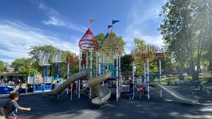 A playground with slides and climbing structures.