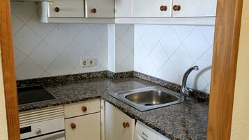 Fridge, microwave, cookware/dishes/utensils