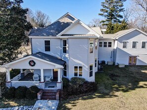 A two-story house with a porch, a garage, and a well-maintained lawn. - **NEW LISTING ** ALOFT in Blue Ridge -New listing in Downtown Blue Ridge (Blue Ridge)