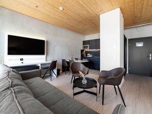 Apartment, City View | Living area | 55-inch LED TV with satellite channels, TV - Dormero HoHo Wien (Vienna)