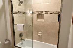 Bathtub, hair dryer, towels, soap