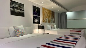A modern hotel room with two beds, a large window, and artwork on the walls. - Essenzia de Cancun (Cancun)