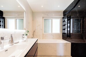 Shower, hair dryer, towels, shampoo