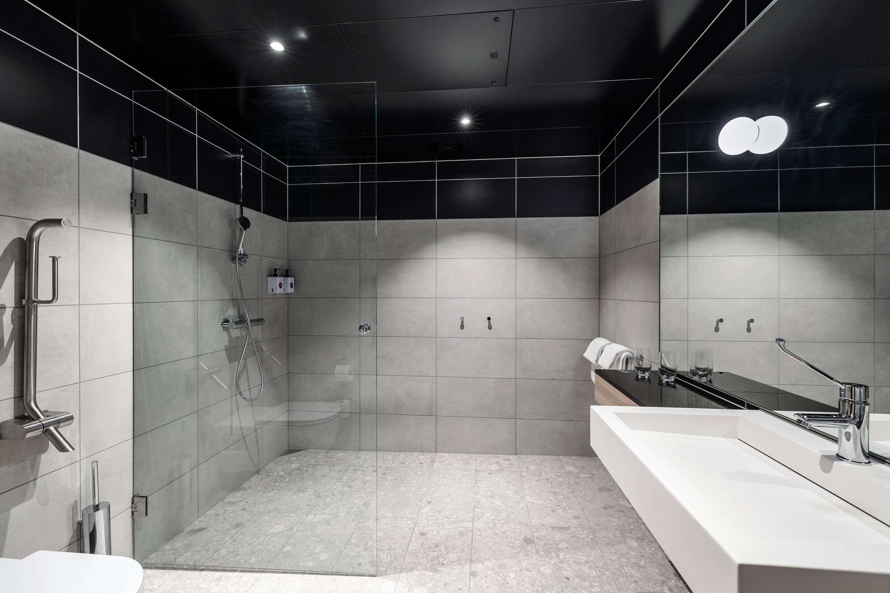 standard double room | bathroom | shower, hair dryer, towels, soap