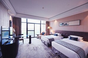 A hotel room with two beds, a desk, a TV, and a large window. - Jiuhua Chunshenhu Suzhou (Suzhou)