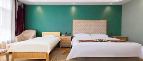 A hotel room with two beds, a wooden headboard, a nightstand, and a chair.