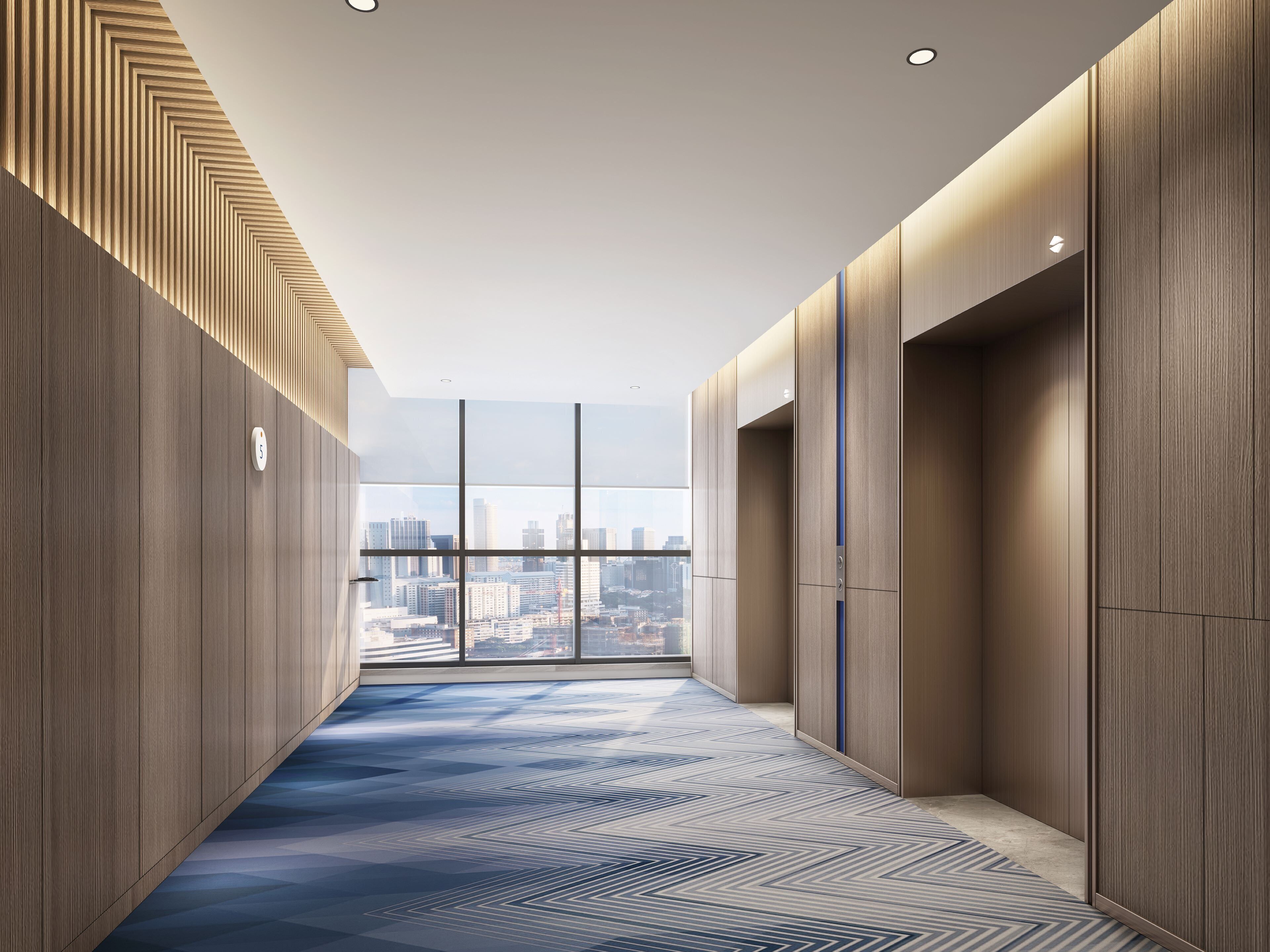 A modern hallway with a city view, wooden paneling, and a patterned carpet.