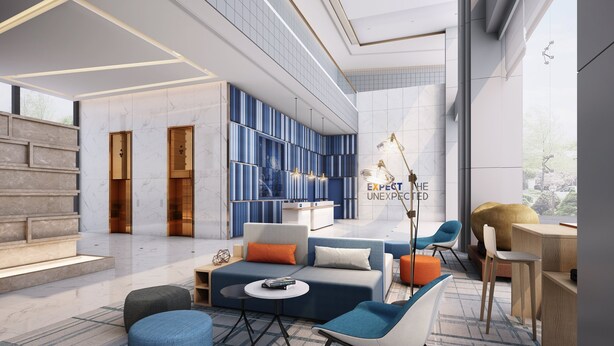 A modern lobby with a high ceiling, marble walls, and a seating area with sofas and chairs. - Holiday Inn Express Shenzhen North Station by IHG (Shenzhen)