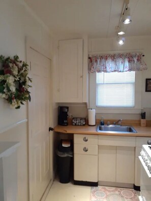 Microwave, coffee/tea maker, cookware/dishes/utensils, paper towels