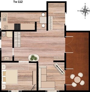 A hotel room layout with a bed, seating area, kitchenette, and a small bathroom.