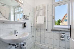 Shower, hair dryer, towels, soap