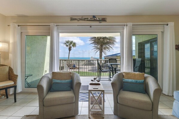 Living area - Spotted Sandpiper Condo Easy access to Pier, Pool and Beach Access are Steps Away by RedAwning (Fernandina Beach)