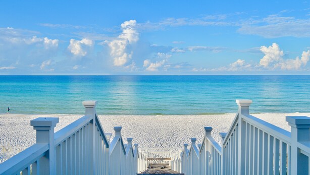 A white wooden boardwalk leading to a beach with a clear blue sky and calm sea. - Beachfront in Seaside on Double Lot, Amazing Gulf views, sleeps 4 + 2 Bikes! (Santa Rosa Beach)