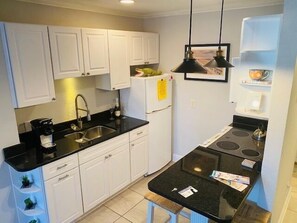 Microwave, coffee/tea maker, toaster, cookware/dishes/utensils