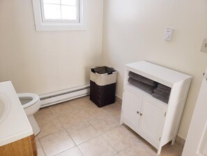 Shower, towels, soap, toilet paper