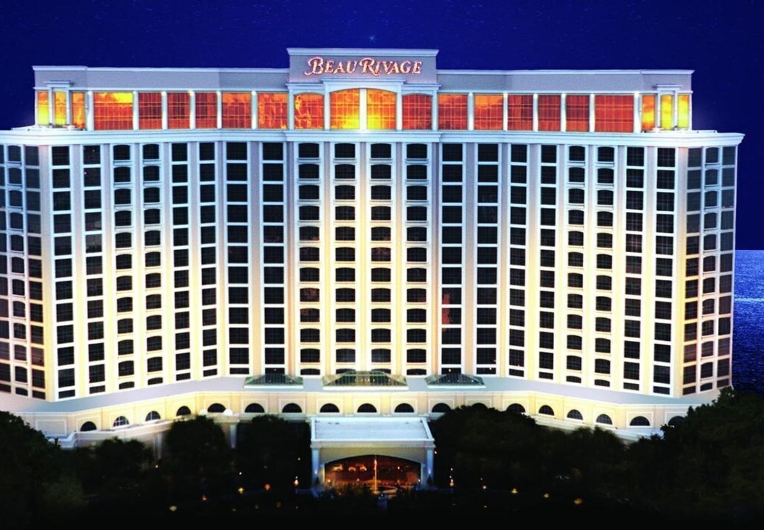 A large, multi-story hotel with a prominent marquee sign at the top.