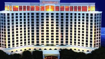 A large, multi-story hotel with a prominent marquee sign at the top.