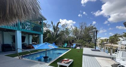 The most setup home in BPK TIKI HUT,POOL ,GRILL ,CANAL FRONT, FREE UNLIMITED ICE