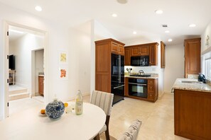 Enjoy cooking in this well-equipped kitchen with an oven, microwave, and large island with a sink.