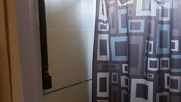 Basic Apartment | Bathroom | Shower, free toiletries, towels, soap