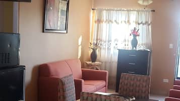 Basic Apartment | Living area | Flat-screen TV