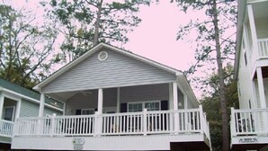 A two-story building with a balcony on the upper floor. - Fun In the Sun ~ Ocean Lakes  (Myrtle Beach)