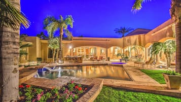 Outdoor pool, a heated pool, sun loungers