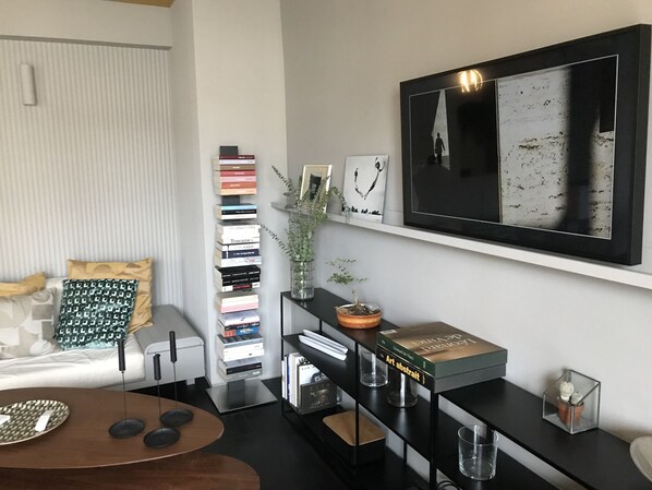 Enjoy a peaceful retreat with a book, art, and comfortable seating.