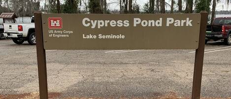 A sign for Cypress Pond Park, Lake Seminole, with a US Army Corps of Engineers logo.
