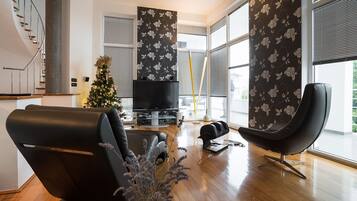 Villa | Living room | 30-inch TV with digital channels, fireplace
