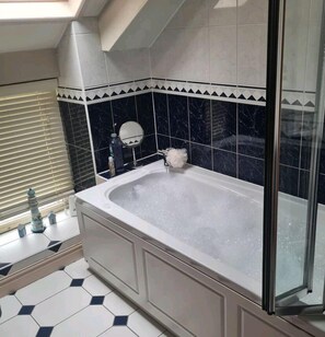 Combined shower/tub, jetted tub