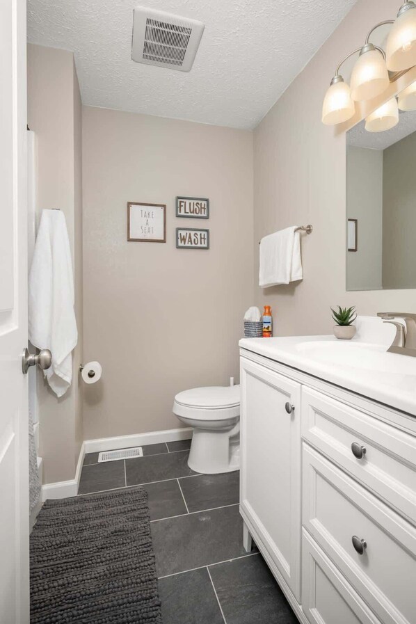 Bathtub, hair dryer, towels