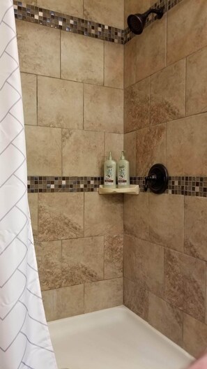 Combined shower/bathtub, hair dryer, towels, soap - Waterfront Home, Hot Tub, Gas Fireplace, Fire Pit, WiFi, Family & Dog-Friendly (Bryson City)