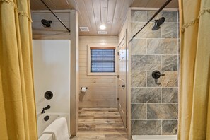 Combined shower/bathtub, hair dryer, towels, soap - Quiet Smoky Mountain Chalet: Unwind by the Fire or in the Hot Tub! (Pigeon Forge)